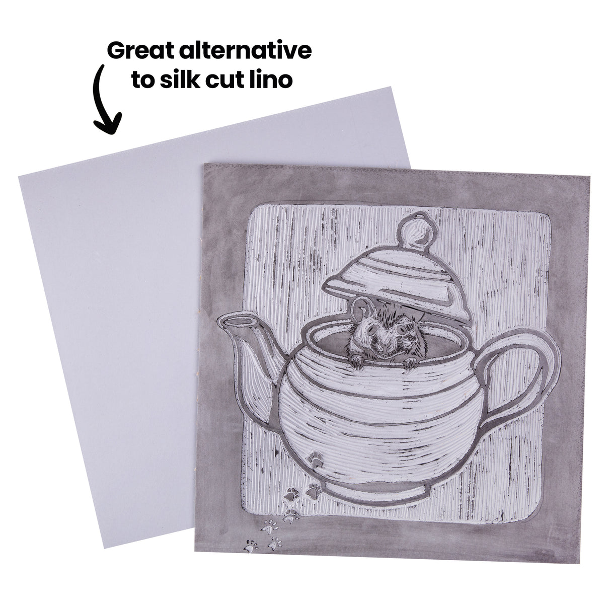 Carved lino block and smooth tile displayed side by side with annotation text reading Great alternative to silk cut lino. The carved block shows a mouse inside a teapot with vertical background lines, while the blank light-grey tile sits slightly behind.