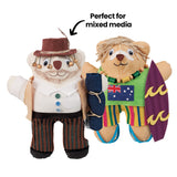 Two decorated calico bears styled as Australian characters — one as a bush figure in a hat with buttons and striped trousers, the other as a surfer holding a surfboard with an Australian flag. An annotation reads "Perfect for mixed media." Demonstrates textile and collage decoration techniques.