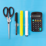 Arrangement of classroom items including scissors, black pen, yellow highlighter, white marker, and calculator aligned on a blue surface, each secured with white loop fastener dots. The dots are partially visible beneath objects, showing their flat circular shape and placement