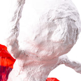 Close-up detail of a plaster bandage sculpture surface, showing layered texture and smooth dried finish, suitable for further decoration or painting.