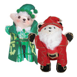 Two calico bears decorated as Christmas characters — one dressed as an elf in green sequined fabric with a pom-pom hat, the other as Santa Claus in a red suit with a white cotton-wool beard. Demonstrates festive mixed-media decoration using fabric, glitter, and found materials.