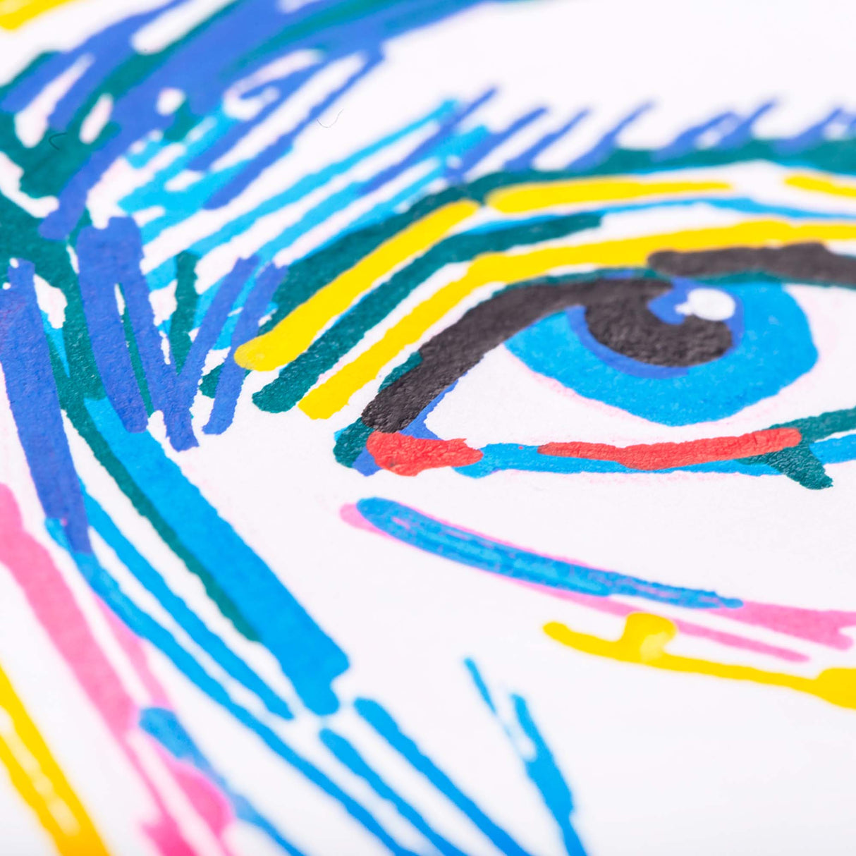 Macro close-up of a portrait drawn with Zart Street Paint Markers, focusing on the eye area. Bright strokes of blue, yellow, teal, pink and black show the textured, opaque marker finish.