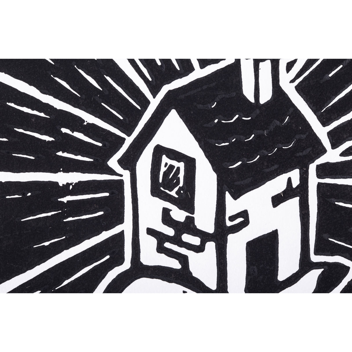 Close-up of a printed section showing part of a house and radiating lines in black ink. The sharp white carved lines against deep black areas illustrate the clarity and contrast produced with Silk Cut Lino Tile.