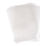 A loosely fanned stack of transparent Zart Acetate Heavyweight Sheets on a white background. The clear rectangular sheets overlap at slight angles, showing their see-through quality, smooth flat surface and thin, flexible form.