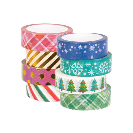 Two stacked columns of Zart Washi Tape, eight rolls total, in festive Christmas prints. One column shows pink and red plaid, gold metallic stripes, purple with gold polka dots, and candy-cane stripes; the other shows deep blue with silver stars, teal with white snowflakes, green pine trees, and green tartan.
