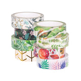 Two stacked columns of Zart Washi Tape, eight rolls total, featuring botanical designs. One column shows blue-grey foliage, black with pink florals, green leaves, and gold geometric branches; the other shows tropical greenery, delicate ferns, red fruit and berries, and soft purple and green fern fronds.