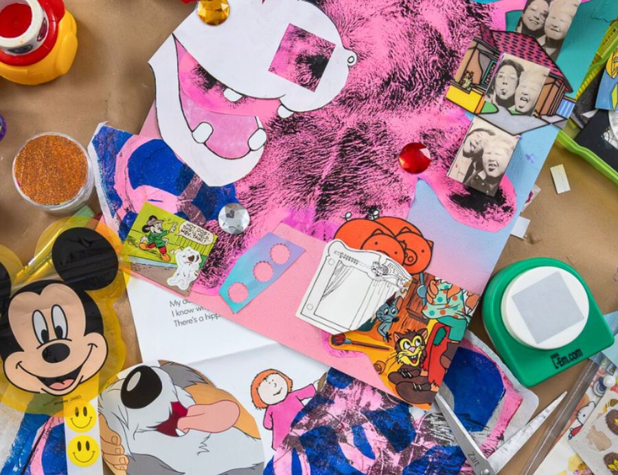 Overhead view of a busy workspace scattered with layered collage materials including magazine cut-outs, cartoon imagery, painted papers, scissors, glitter and adhesive tools. Bright colours and overlapping textures fill the table surface. Image credit: Zart Education PL Art & Junk Journalling with Francesca Spillane.