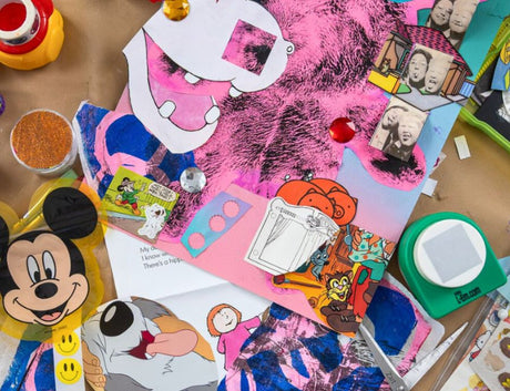 Overhead view of a busy workspace scattered with layered collage materials including magazine cut-outs, cartoon imagery, painted papers, scissors, glitter and adhesive tools. Bright colours and overlapping textures fill the table surface. Image credit: Zart Education PL Art & Junk Journalling with Francesca Spillane.