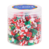 Clear plastic container filled with festive Christmas-themed silicone beads in red, green, and white colours, featuring miniature presents, candy canes, peppermint swirls, Santa figures, and decorated baubles. The lid displays the by Zart branding with a colourful rainbow border on a blue background.