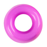 Bright pink translucent pony bead photographed from above against a white background, displaying a cylindrical shape with a large central hole for threading, showing smooth glossy surface with subtle light reflections along the curved edges.