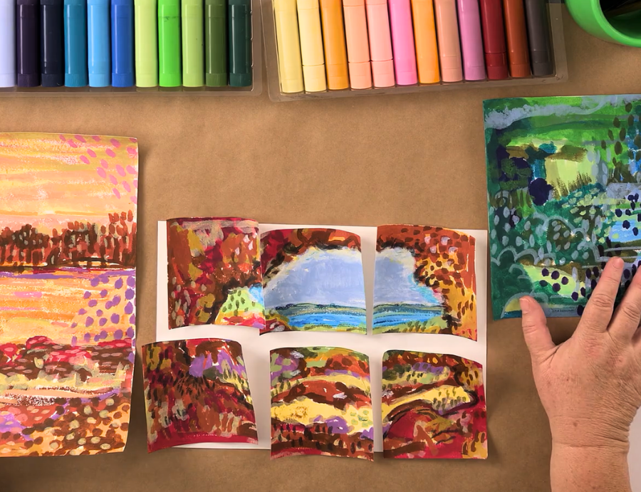 An overhead view shows a series of small, curved landscape paintings arranged on a table, featuring bold, layered colours and expressive mark-making. Pastel sticks sit neatly above, while a hand adjusts one piece, capturing creative exploration at Zart Professional Learning Book Week 2026.