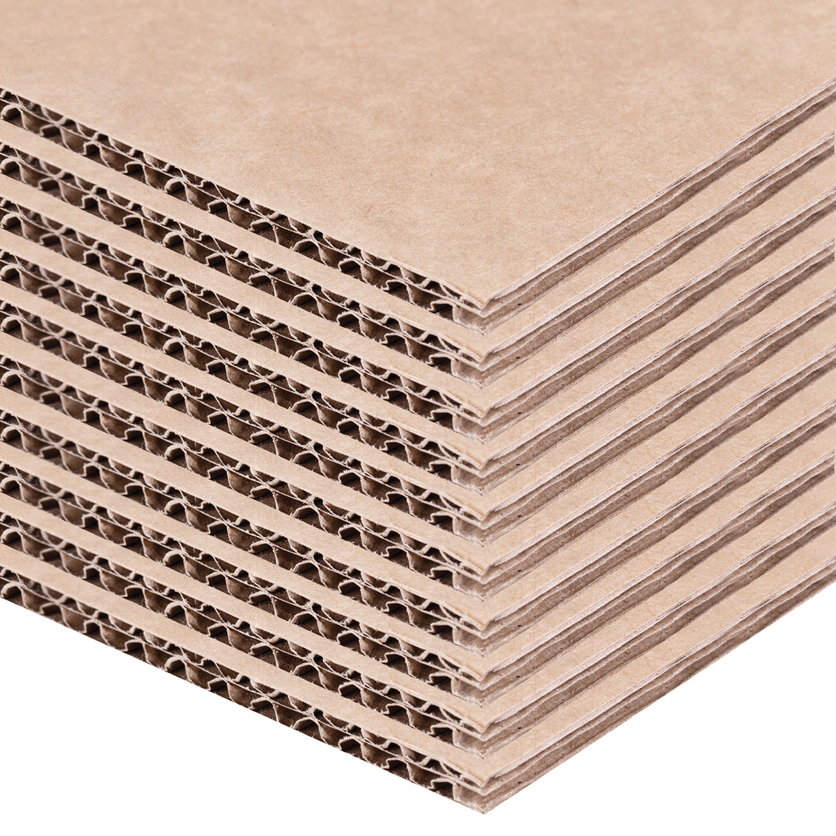 A close-up stack of brown Backdrop Card sheets is shown layered diagonally against a pale background. The exposed corrugated edges reveal repeating fluted cardboard channels, while the smooth kraft paper surfaces display natural fibre texture and sturdy construction suitable for model making and display projects.