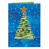 A hand-decorated card made using a Zart Stitch Cards Tree and Star card, painted in deep blue with white speckled snow. A woven green paper tree, threaded through stitched slits, is trimmed with red, green, silver and gold foil beads, topped with a glittery gold star.