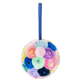A round ornament made using Zart Chenille Stems Ombre, formed from tightly coiled fuzzy rosettes in soft pastel shades — blush pink, sky blue, lilac, mint, navy and yellow. A royal blue ribbon loop extends from the top, allowing the ball to hang.