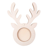 Unfinished wooden reindeer-shaped ornament frame with branching antlers and circular photo opening in the centre. Natural plywood construction with visible wood grain texture and small hanging hole at top. Ready to decorate for Christmas craft projects.