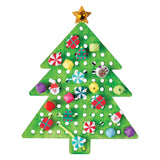 Green wooden Christmas tree shape with pre-drilled holes, decorated with colourful threaded embroidery featuring festive motifs including Santa faces, reindeer, wrapped presents, candy canes, peppermint swirls, and geometric beads in red, yellow, pink, purple, and blue. Gold metallic star tops the tree.