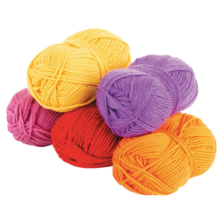 Arrangement of warm-coloured 4 Ply acrylic wool yarn balls in red, orange, yellow, violet and dusty pink. The yarn appears soft and evenly spun, with tightly wound strands forming smooth, rounded balls with a consistent thickness.