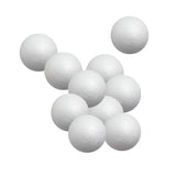 Ten Zart Poly Deco Foam balls arranged in a loose cluster against a white background. Each smooth white sphere shows the lightly dimpled, beaded foam texture across its surface, with a faint moulding seam running around the middle of each ball.