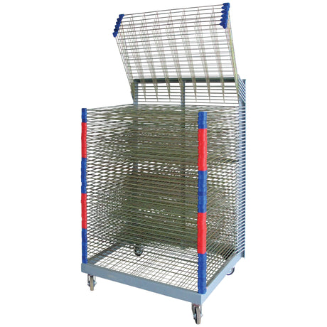 Tall metal drying rack on castor wheels, shown against a white background, featuring multiple horizontal wire mesh shelves for drying artwork or prints. The rack has a hinged top section that is raised open, revealing the stacked shelf design. Vertical corner posts are wrapped with alternating red and blue protective grips, and the sturdy grey metal base supports four swivel wheels for easy movement around a classroom or studio.