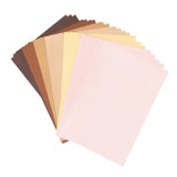 A fanned display of Friendship Colour Premium Craft Paper A4 sheets showing a range of skin-tone shades from deep brown through tan, beige, cream, and pale yellow to soft pink tones. The textured paper sheets are arranged in an overlapping arc against a white background, displaying the inclusive colour palette.