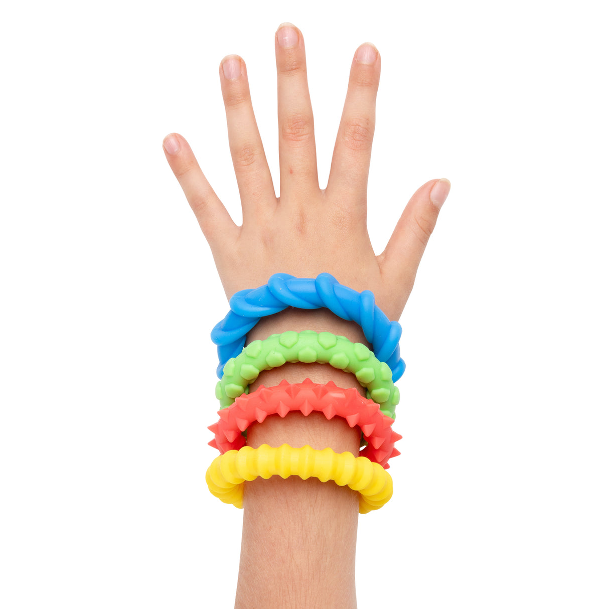 Child's hand and wrist wearing four brightly coloured textured fidget bracelets in blue, green, coral, and yellow. Each Sensory Sprouts bracelet features a raised bumpy surface pattern, stacked together on the wrist against a white background, demonstrating their sensory tactile qualities.