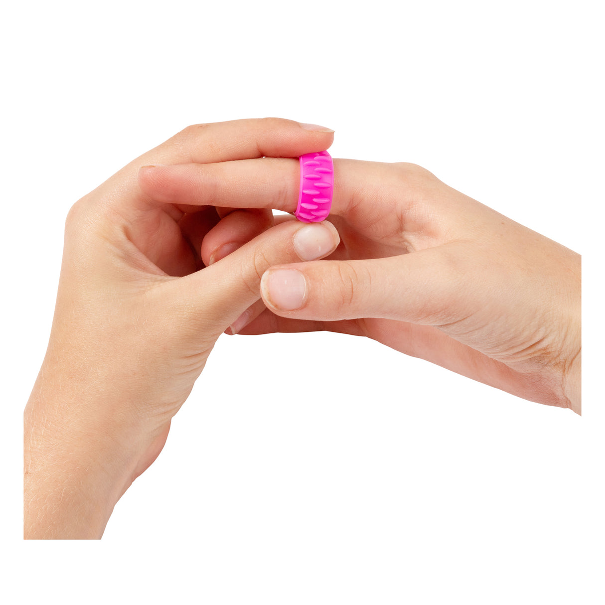 Two hands holding a bright pink textured fidget ring with raised ridged patterns around its surface. The Sensory Sprouts Textured Fidget Ring features a silicone construction with tactile bumps designed for sensory stimulation and fine motor development, shown against a clean white background demonstrating its size and flexible design.