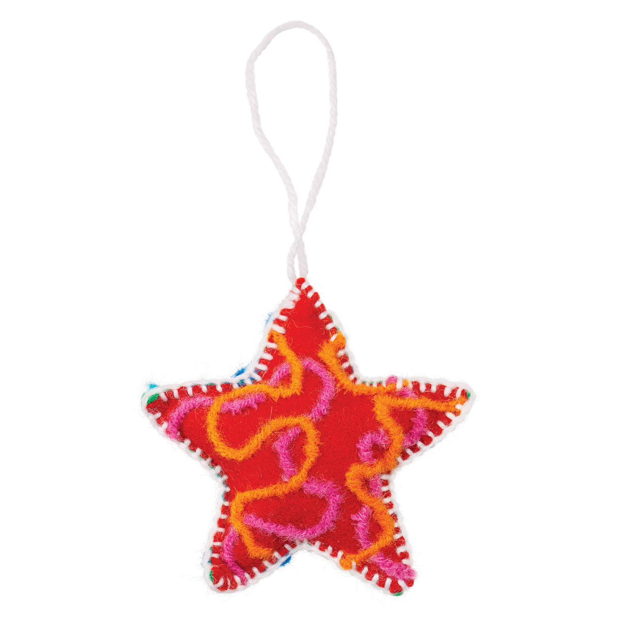 A hand-stitched felt star sample made using Zart Felt Star Decorations, in red with a swirling orange and pink yarn design across the surface. White blanket stitching traces the star's outline, with the raised yarn adding bold colour and texture against the red felt base.