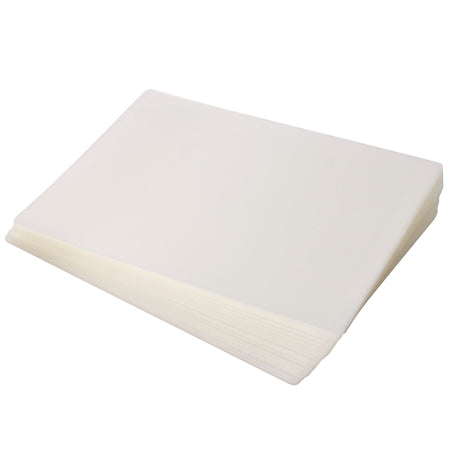 A stack of Zart Laminating Pouches is displayed diagonally against a pale grey background. The translucent frosted sheets feature smooth surfaces, rounded corners, and layered semi-transparent edges that create a soft milky appearance through the stacked plastic construction.