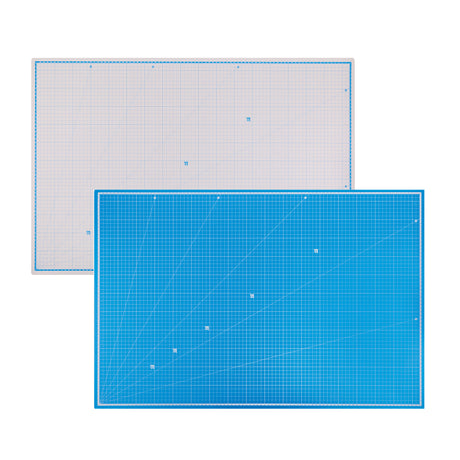 Self Healing Double Sided Cutting Mat in A1 size, shown from both sides — one grey with blue grid lines, the other blue with white grid lines. Both feature a printed measurement grid, numbered rulers along the edges and diagonal angle guides at 15, 30, 45, 60 and 75 degrees.