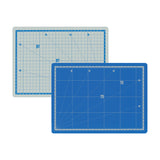Self Healing Double Sided Cutting Mat in A4 size, shown from both sides — one grey with blue grid lines, the other blue with white grid lines. Both feature a printed measurement grid, numbered rulers along the edges and diagonal angle guides at 15, 30, 45, 60 and 75 degrees.