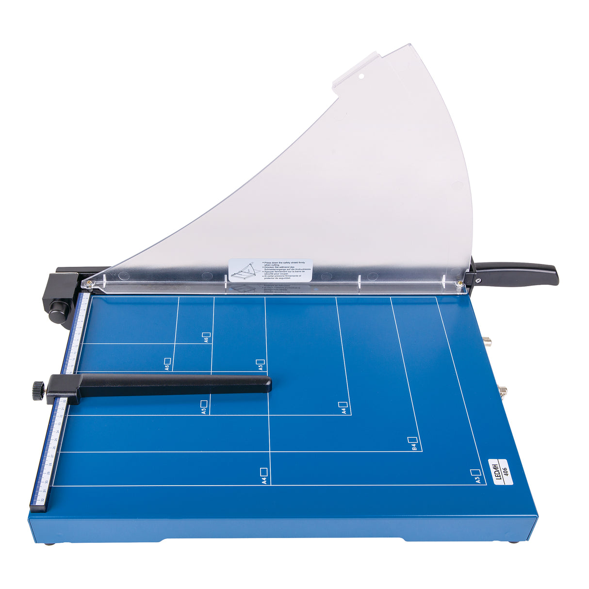 Ledah Professional Guillotine A3 paper cutter with a blue metal base featuring white grid markings and labelled paper sizes. A transparent curved safety guard sits above the cutting area, with a black handle and blade arm, plus a side ruler for alignment.