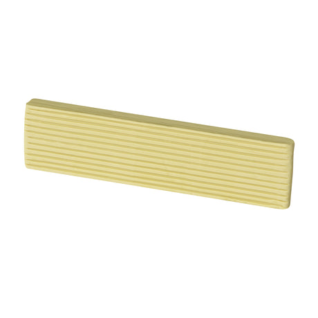 Ivory clay block in a warm off-white tone. Rectangular with rounded ends and ribbed sides. Surface is smooth and matte with a creamy, slightly yellowed appearance.