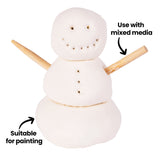 Small snowman figure constructed from white Crayola Model Magic with rounded stacked forms and inserted wooden stick arms, showing a soft matte texture and light surface imperfections, with on-image text reading “Suitable for painting” and “Use with mixed media”.
