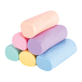Stacked Zart Claydough logs in Pastel palette colours including peach, soft pink, lavender purple, mint green, pale yellow and light blue. Smooth rounded cylindrical shapes with soft, slightly matte surface and faint texture variations.