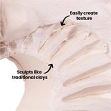 Close-up of clay surface with carved marks and ridges, showing texture detail with on-image text reading “Easy to create texture” and “Sculpts like traditional clay”.