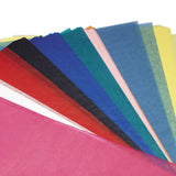 Assorted coloured Zart Tissue Paper 50x75cm sheets are fanned diagonally across a pale grey background. The lightweight translucent paper features layered overlapping edges in pink, red, black, blue, teal, peach and yellow tones, creating soft colour transitions and delicate textured surfaces.