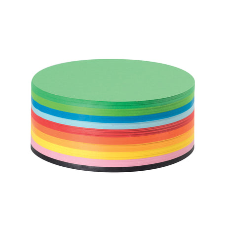 A pack of 500 Coloured Paper Circles in 12cm diameter, shown as a compact stacked cylinder. Ten colour bands are visible on the side, including green, blue, light blue, red, orange, yellow, pink, and black. The top circle is bright green.