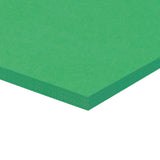 A corner of a stack of green Zart Cover Paper shown at an angle against a white background. The top sheet has a smooth, even surface, and the layered edge reveals the depth of the pack with its neatly aligned sheets.