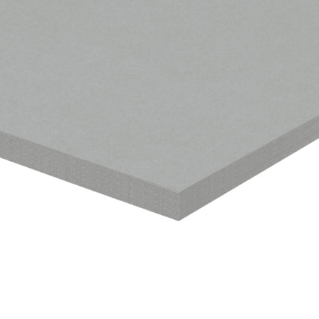 A corner of a stack of grey Zart Cover Paper shown at an angle against a white background. The top sheet has a smooth, even surface, and the layered edge reveals the depth of the pack with its neatly aligned sheets.