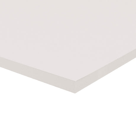 A corner of a stack of white Zart Cover Paper shown at an angle against a white background. The top sheet has a smooth, even surface, and the layered edge reveals the depth of the pack with its neatly aligned sheets.