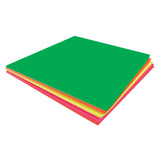 Stack of vibrant fluorescent coloured paper squares in green, orange, yellow, and pink. The bright neon sheets are layered to showcase the colour range, with the dominant green square on top displaying the smooth paper texture.