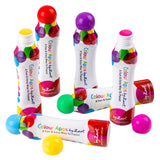 Multiple Zart Colour Apps bottles standing and lying on a white background, each with a different coloured rounded cap. The bottles display bright, overlapping circle graphics, with loose caps scattered nearby to show colour variety.