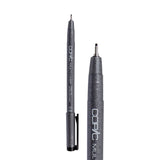 A Copic Multi Liner fineliner pen with a 0.8mm nib, shown uncapped alongside a close-up of the tip. The dark grey speckled barrel displays white "COPIC MULTI LINER" lettering and a black clip on the cap. The metal-collared nib extends to a broader, visibly wider black point.