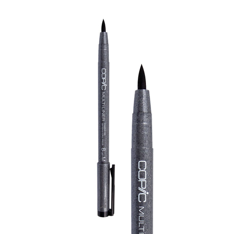 A Copic Multiliner brush tip pen shown uncapped alongside a close-up of the tip. The dark grey speckled barrel displays white "COPIC MULTILINER" lettering and a black clip on the cap. The flexible black brush tip comes to a pointed tip, distinct from the metal-collared fineliner nibs in the range.