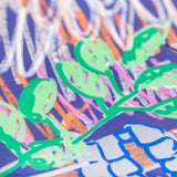 Macro detail of POSCA marker artwork showing bright green leaves layered over textured strokes of orange, pink, white and blue on dark paper.
