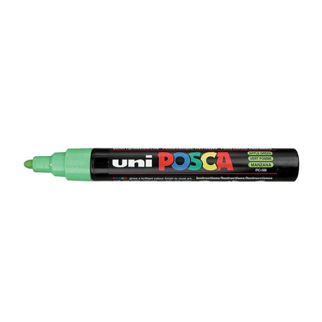 A uni POSCA paint marker shown horizontally against a white background. The glossy black cylindrical barrel carries the colourful POSCA branding and is topped by a uni clip, with the coloured cap or exposed bullet nib indicating the paint colour inside.
