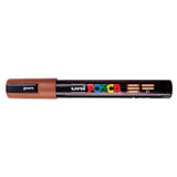 A uni POSCA paint marker shown horizontally against a white background. The glossy black cylindrical barrel carries the colourful POSCA branding and is topped by a uni clip, with the coloured cap or exposed bullet nib indicating the paint colour inside.