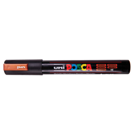 A uni POSCA paint marker shown horizontally against a white background. The glossy black cylindrical barrel carries the colourful POSCA branding and is topped by a uni clip, with the coloured cap or exposed bullet nib indicating the paint colour inside.