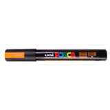 A uni POSCA paint marker shown horizontally against a white background. The glossy black cylindrical barrel carries the colourful POSCA branding and is topped by a uni clip, with the coloured cap or exposed bullet nib indicating the paint colour inside.