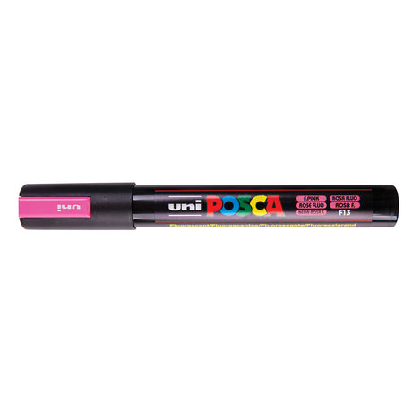 A uni POSCA paint marker shown horizontally against a white background. The glossy black cylindrical barrel carries the colourful POSCA branding and is topped by a uni clip, with the coloured cap or exposed bullet nib indicating the paint colour inside.